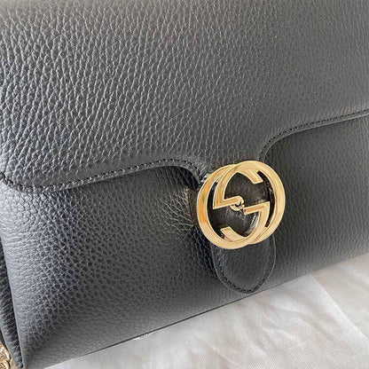 Gucci interlocking G black leather flap bag with goldtone hardware