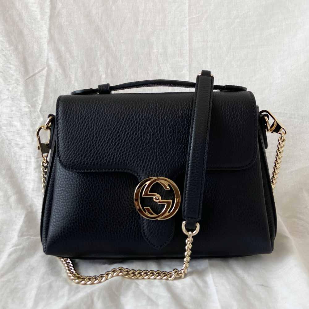 Gucci interlocking G black leather flap bag with goldtone hardware