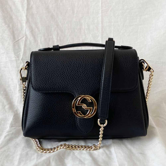 Gucci interlocking G black leather flap bag with goldtone hardware