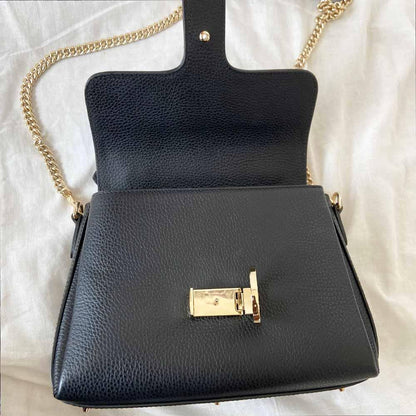 Gucci interlocking G black leather flap bag with goldtone hardware