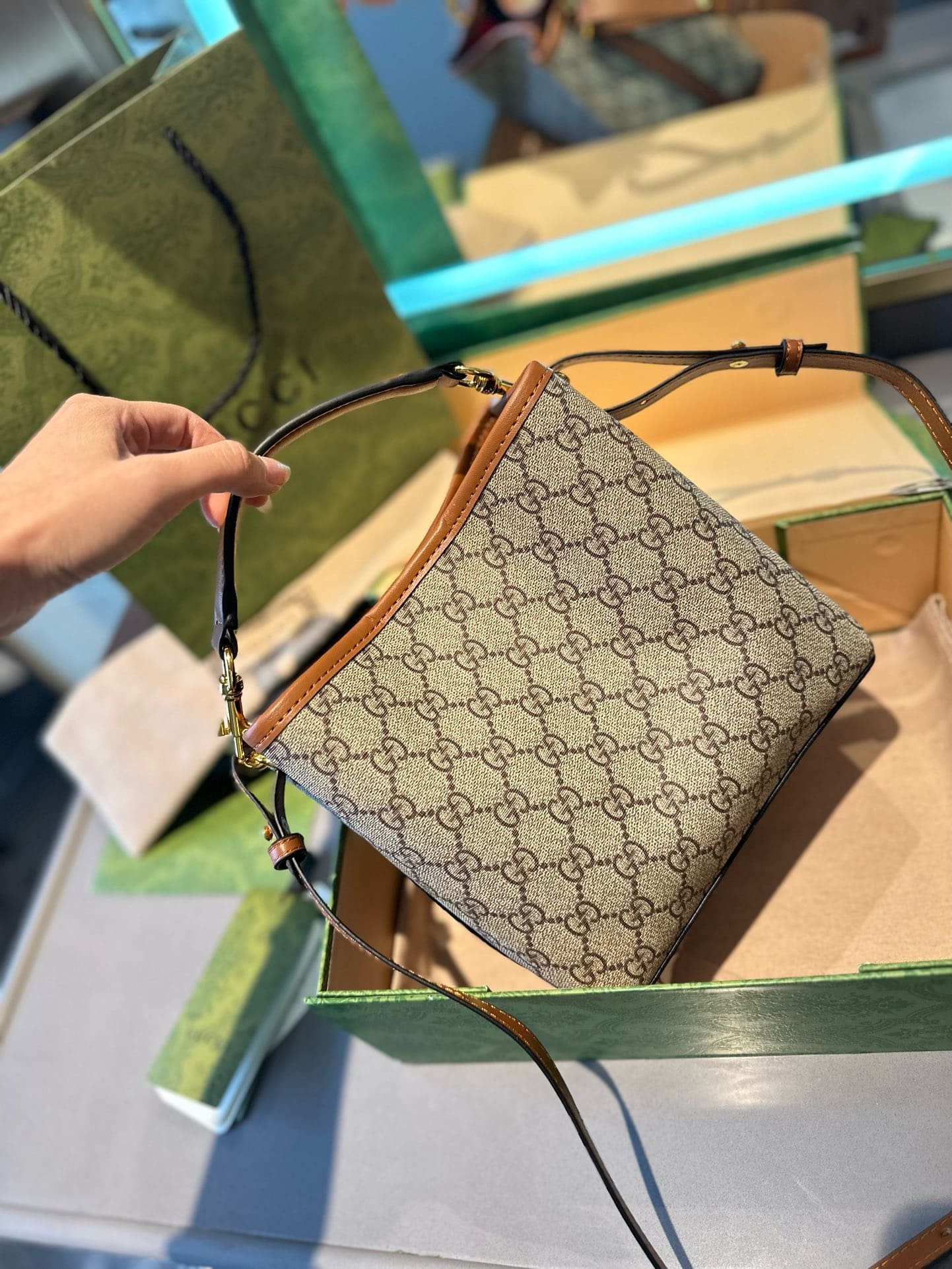 GUCCI GG Emblem mini bucket bag