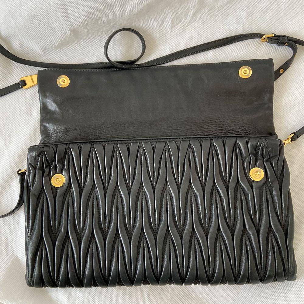 Miu Miu black leather matelasse fold over clutch bag