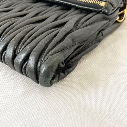 Miu Miu black leather matelasse fold over clutch bag