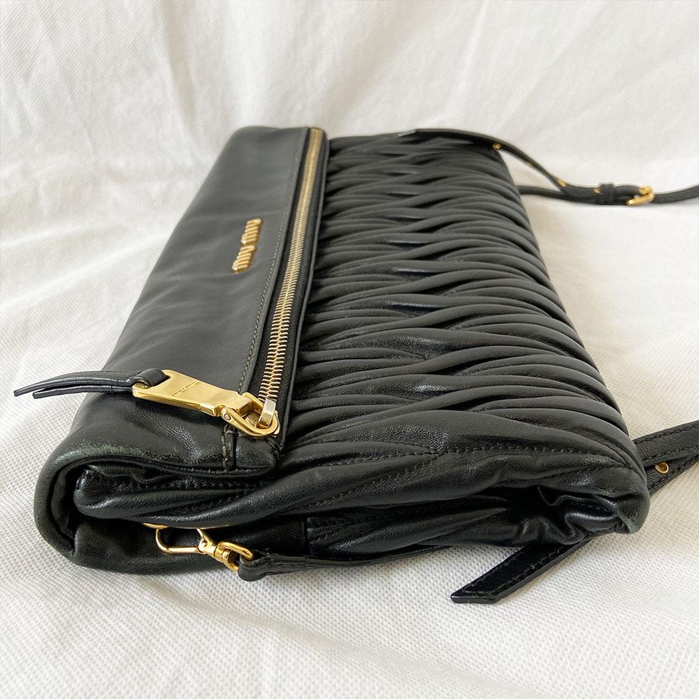 Miu Miu black leather matelasse fold over clutch bag