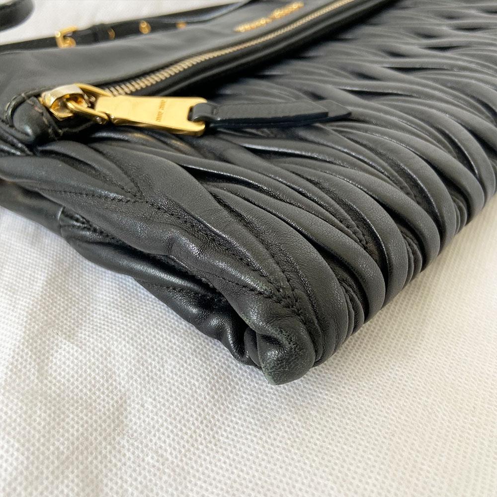 Miu Miu black leather matelasse fold over clutch bag