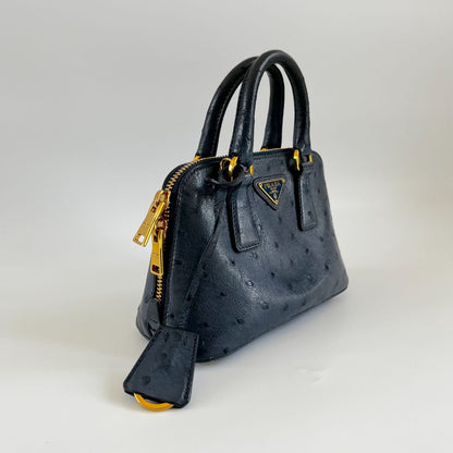 Prada navy blue ostrich leather micro top handle bag