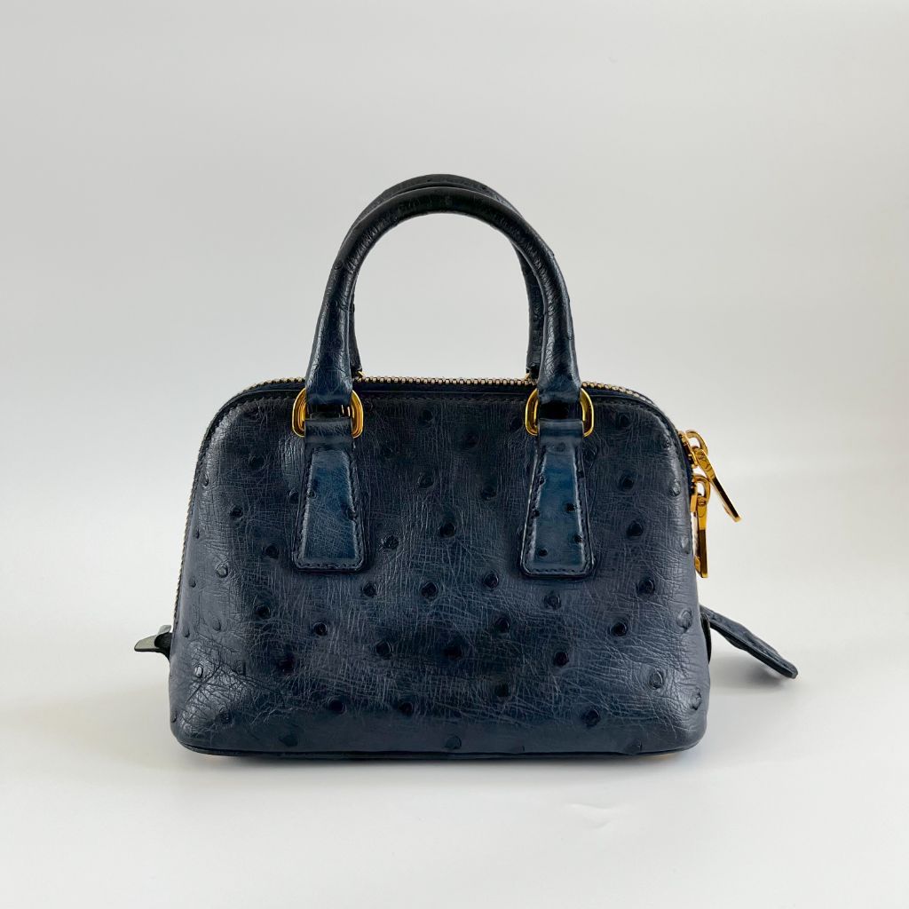 Prada navy blue ostrich leather micro top handle bag