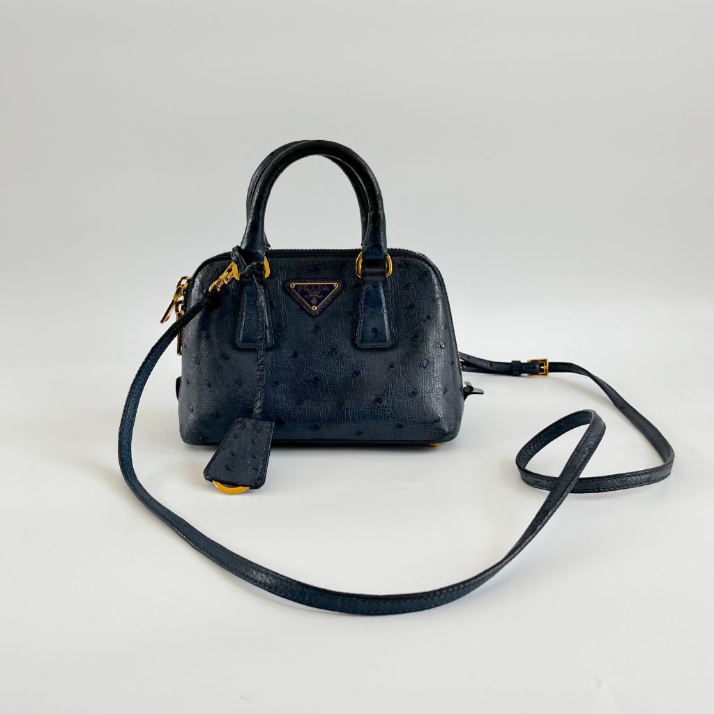 Prada navy blue ostrich leather micro top handle bag
