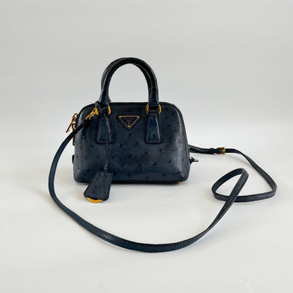 Prada navy blue ostrich leather micro top handle bag