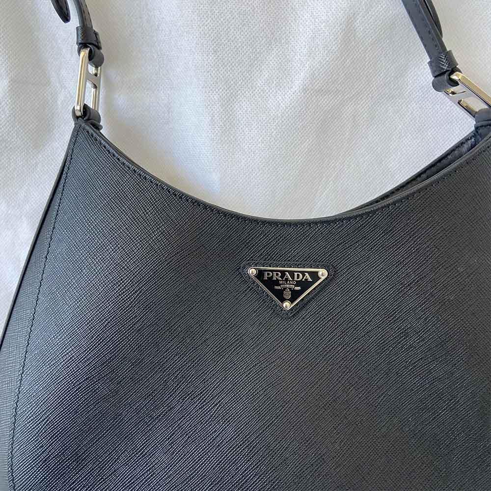 Prada triangle logo cleo bag in saffiano black leather