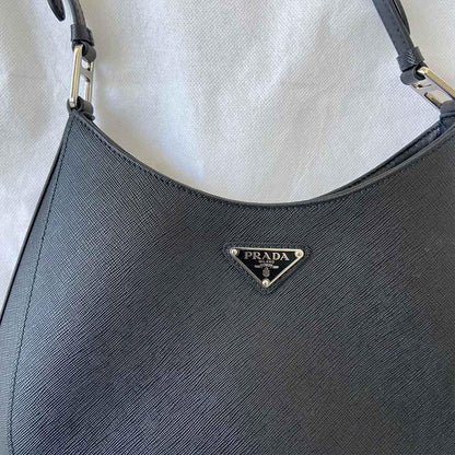 Prada triangle logo cleo bag in saffiano black leather