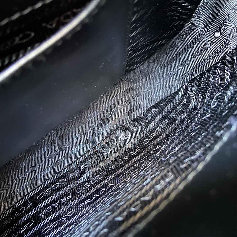 Prada triangle logo cleo bag in saffiano black leather