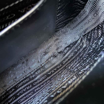 Prada triangle logo cleo bag in saffiano black leather