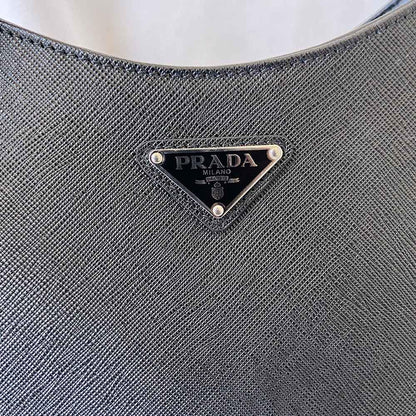 Prada triangle logo cleo bag in saffiano black leather