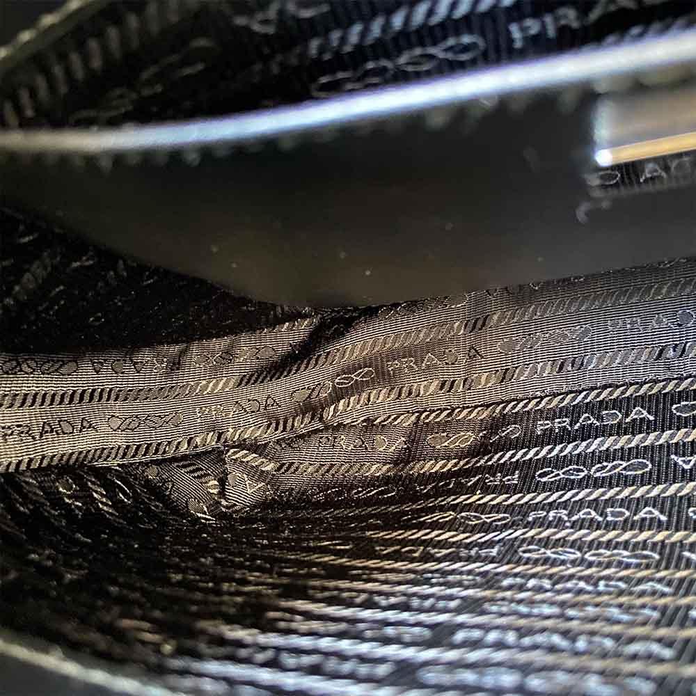 Prada triangle logo cleo bag in saffiano black leather