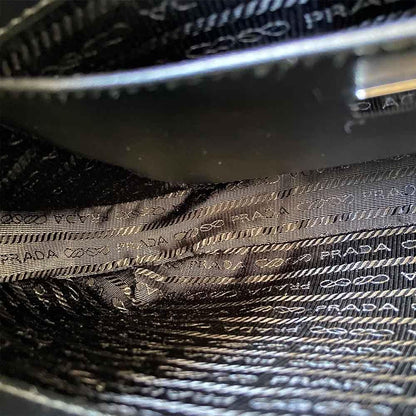 Prada triangle logo cleo bag in saffiano black leather