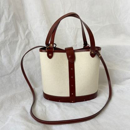 The Row beige canvas and leather bucket bag