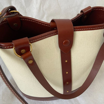The Row beige canvas and leather bucket bag