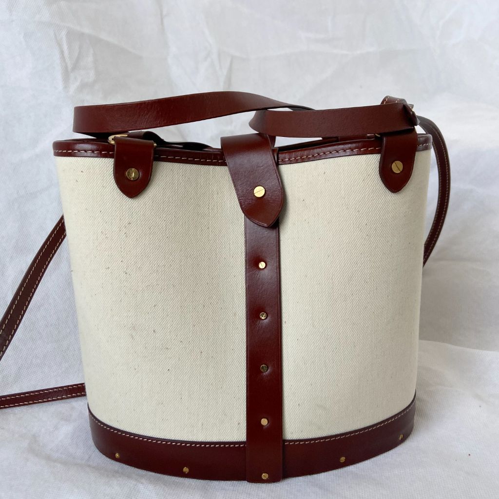 The Row beige canvas and leather bucket bag